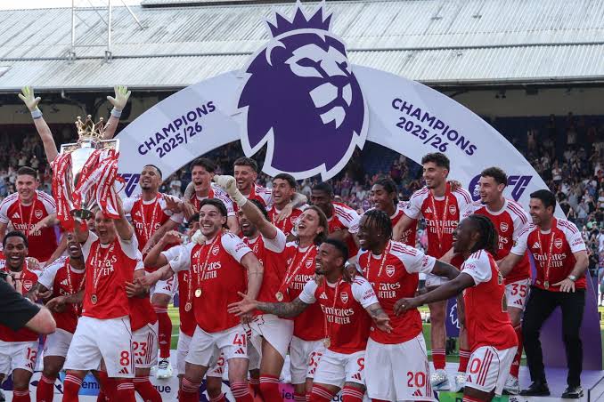 Arsenal players lift the 2025-2026 Premier League title.